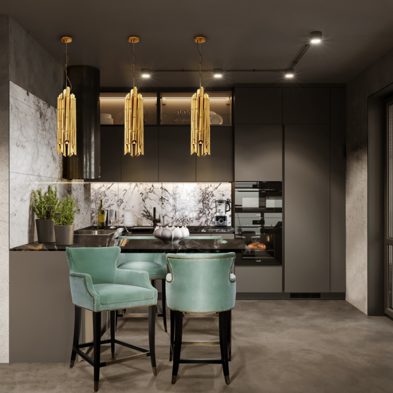 a kitchen in dark tones with blue chairs 