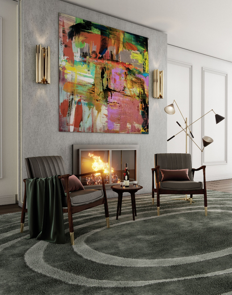living room with a fireplace, two chairs and a paint in the wall 