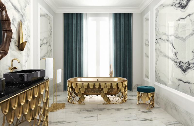 luxurious bathroom with a marble wall, black marble washbasin and a gold bathtub