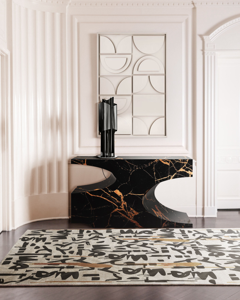 modern entryway with a painting in the wall and a modern black marble console 