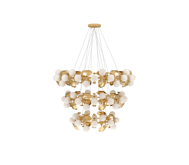 avenue interior design - modern lighting fixture is constructed with two tiers, with pendant lights hanging from a round brass structure. Bulbs in frosted glass