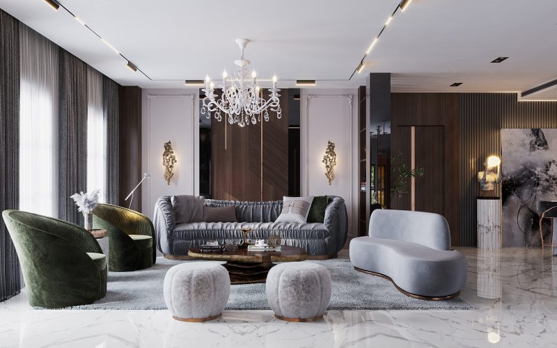 two green armchairs, a grey sofa, an odette nude sofa with  gold details and a white chandelier