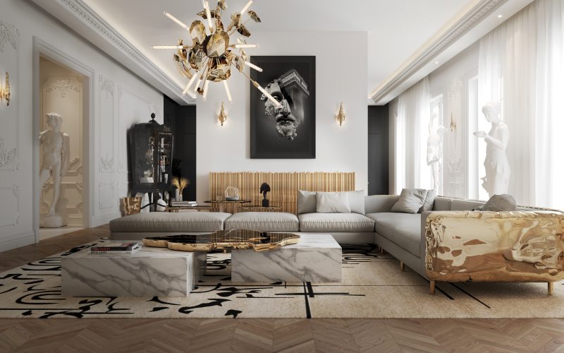 imperfectio modular sofa with solid structure in polished brass, navarra center table with marble and a black top with gold details and supernova chandelier