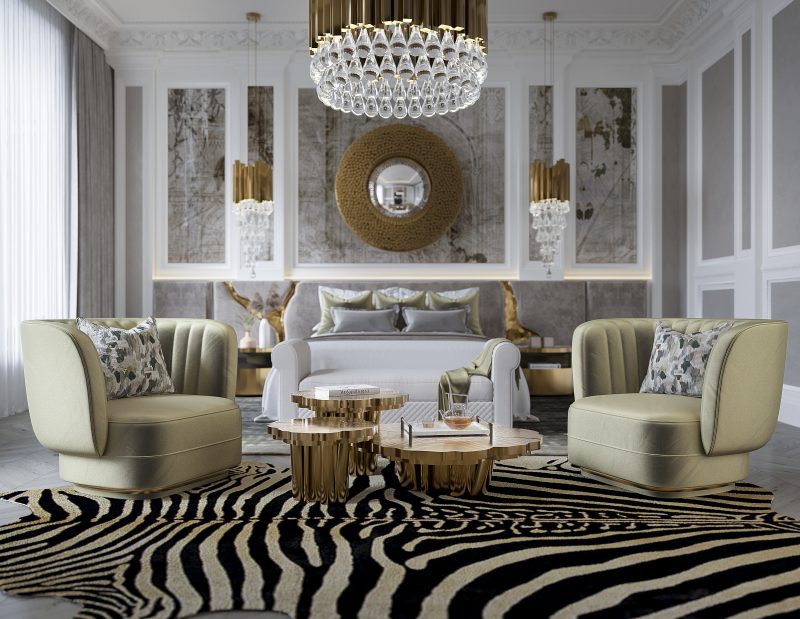 master bedroom with lapiaz headboard in grey velvet newton mirror, fortuna center table in gold and two sage green harmchairs