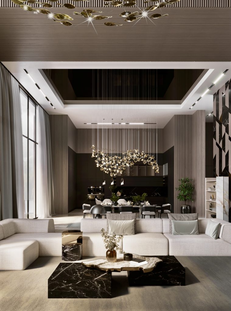 luxury living room with modular sofa in white and a contemporary center table composed by two square marble modules, linked by an organic marble surface element on top enveloped by casted brass