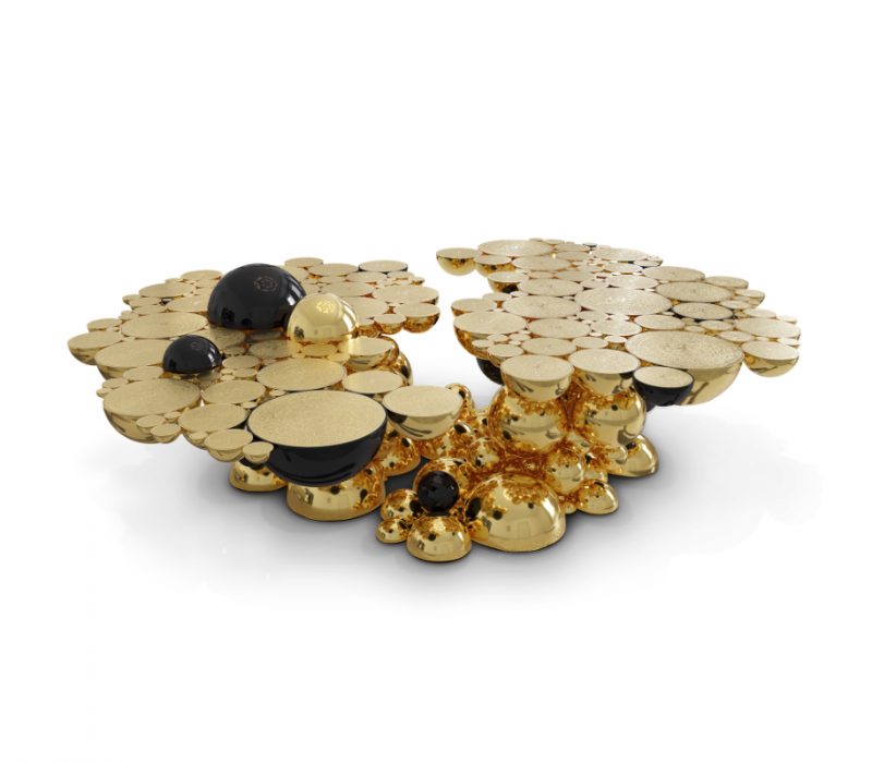 luxury living rooms - oval center table built from aluminium spheres in gold and black