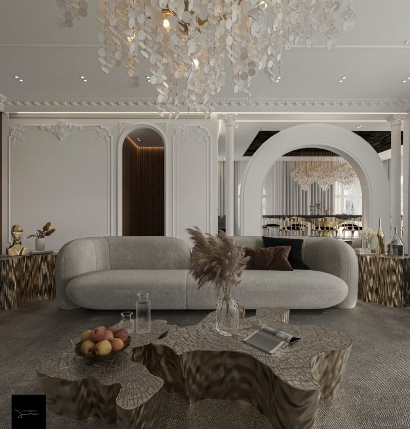 luxurious living room with nude sofa and a ser of two center tables that incorporates nature-inspired design