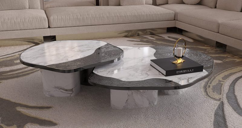 Ophelia Center Table - marble and black center table, a book, a rug and a cream and gold sofa