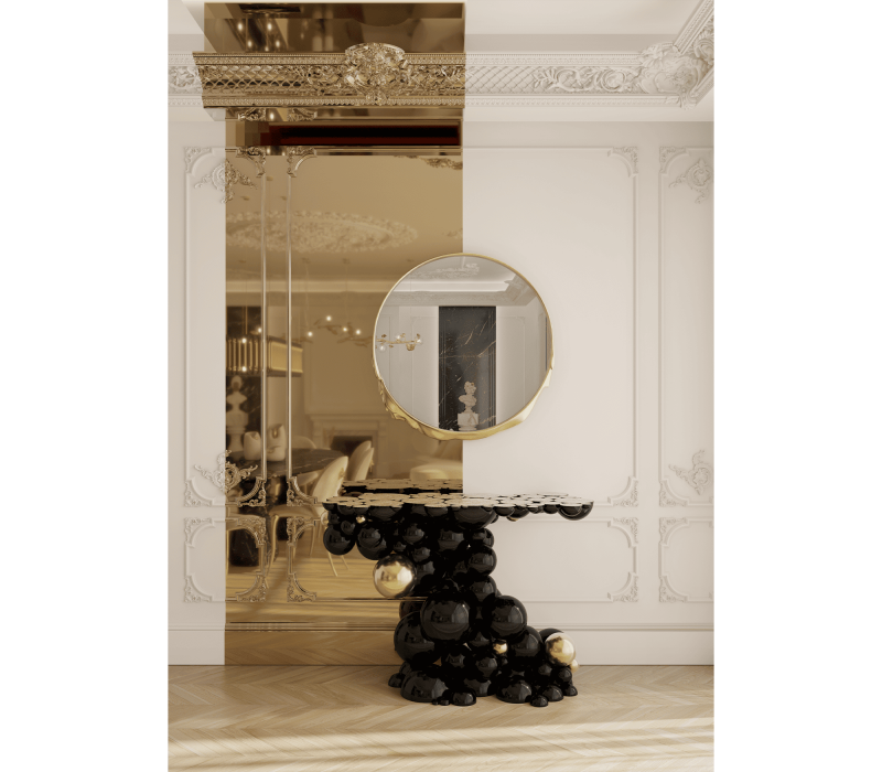A black and gold newton console with a mirror et and a white mirror