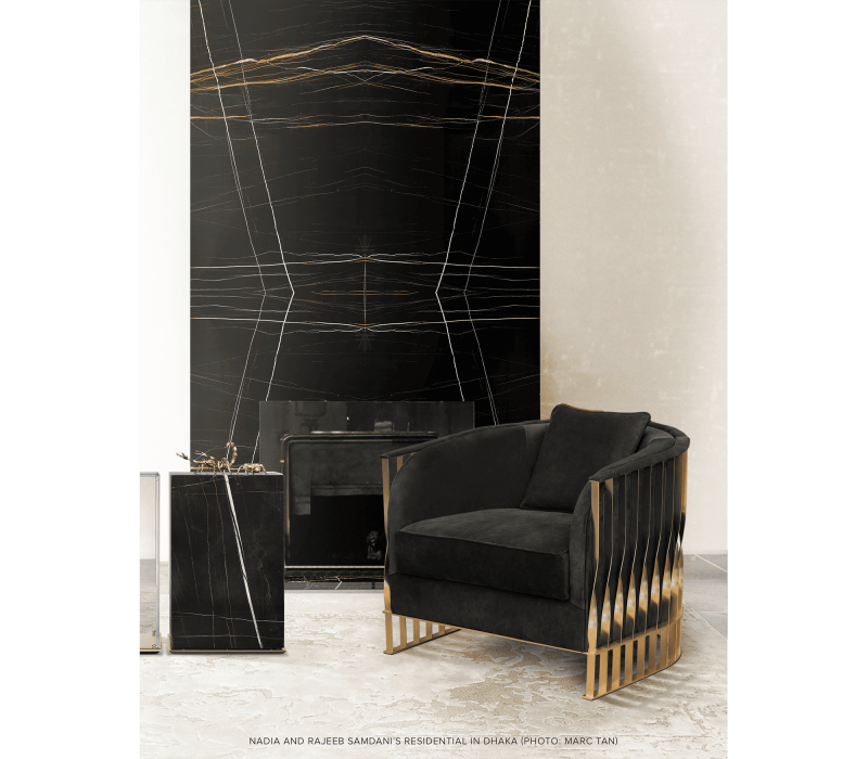 this is an black mandy exceptional armchairs with a black paint in the background